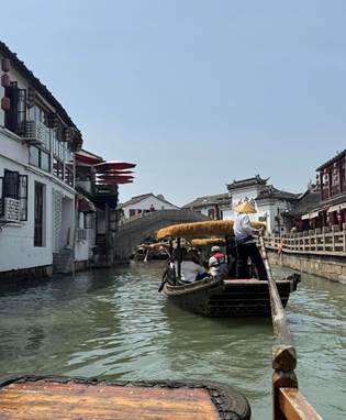 May be an image of 3 people and boat