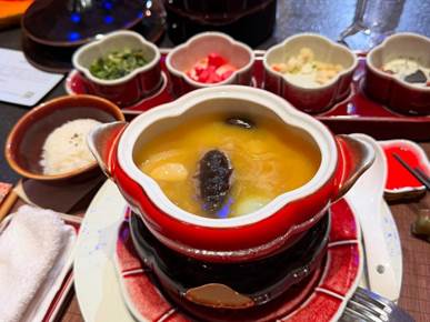 May be an image of hot pot, fondue, congee and text
