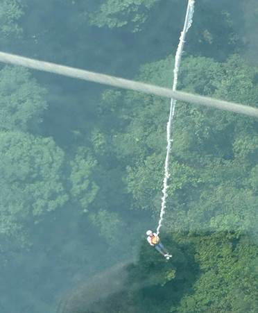 May be an image of 1 person and skydiving